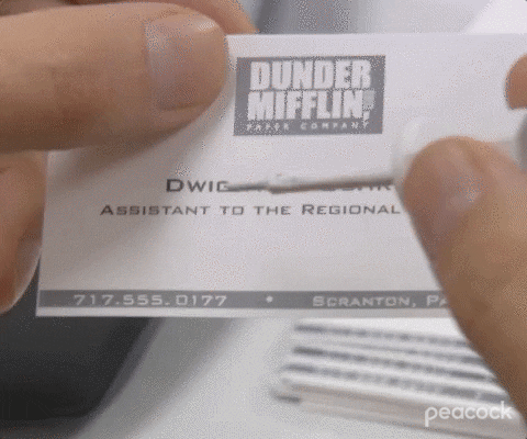 GIF of Dwight Schrute whiting out his business card's title