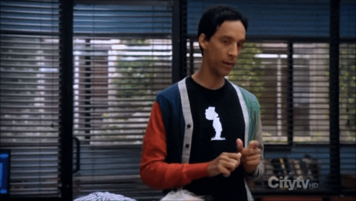 GIF of a group of people talking in a conference room
