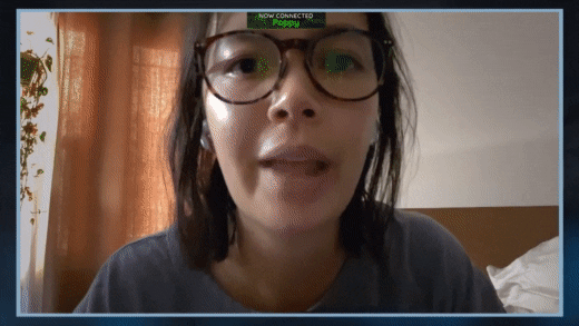 Woman eating cereal while talking to a man on a zoom call 