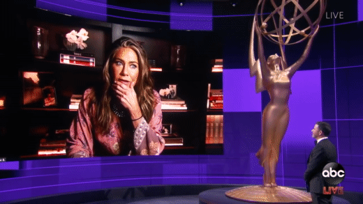 Jennifer Aniston and Courtney Cox being displayed on the screen at the Emmy's as they attend virtually