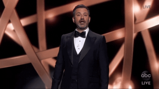 GIF of Jimmy Kimmel hosting the Emmy's with a montage of audience members laughing