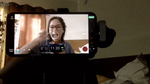 GIF of POV from camera recording two people creating digital content