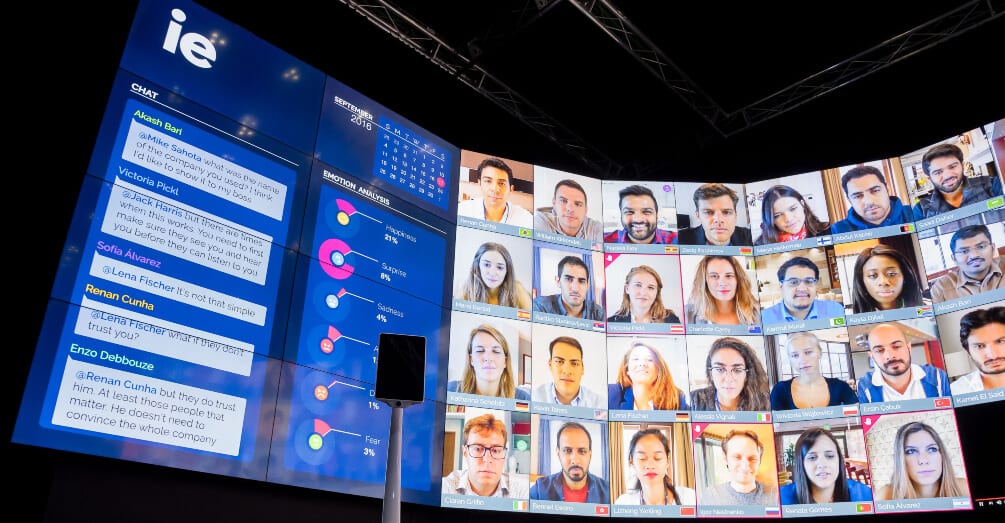 LED Screen displaying Chat, emotion analytics, the date, and faces of virtual attendees