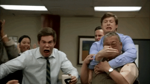 GIF of people in an office screaming while staring at something just off camera