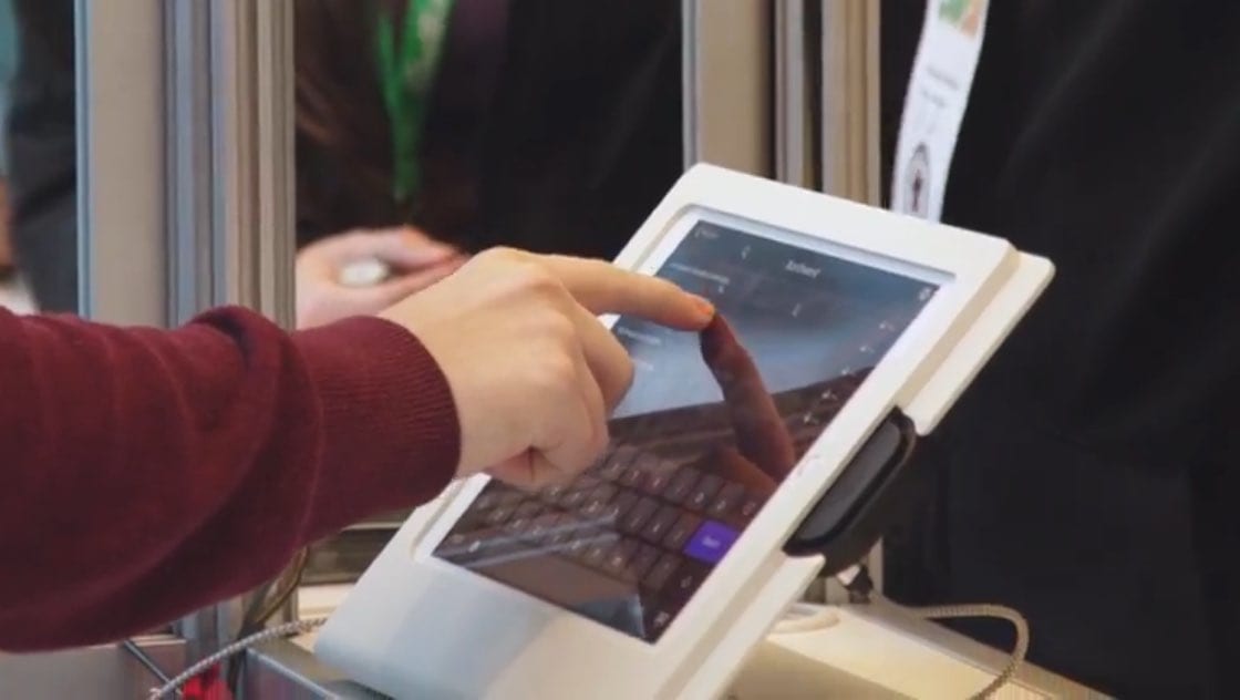 Event-Success-Hybrid-Virtual-Expo-Pass-4 Person using onsite registration software on iPad kiosk at event