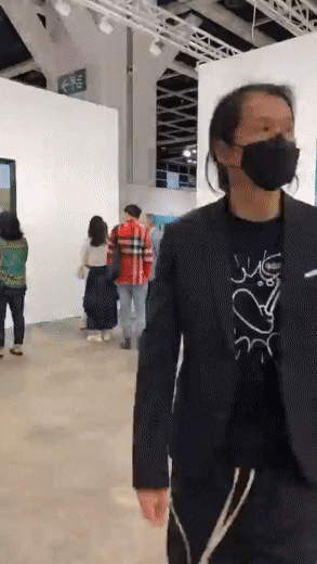Time lapse GIF of a person's POV while walking through an in person museum event