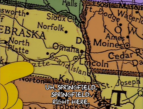 Bart Simpson pointing to Springfield, IL on a map