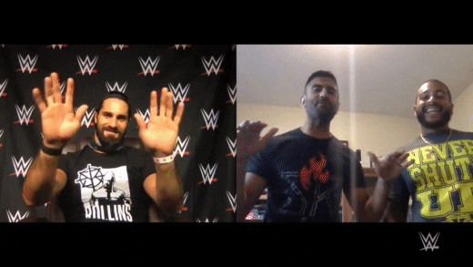 GIF of WWE meet and greet between male wrestler and two male fans