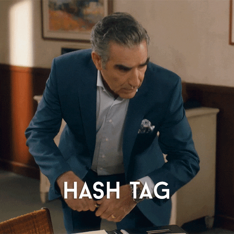 Gif of man saying "Hash Tag. Is that two words?"