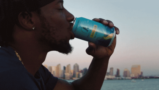 GIF of a man driving out of a can and then going on a run