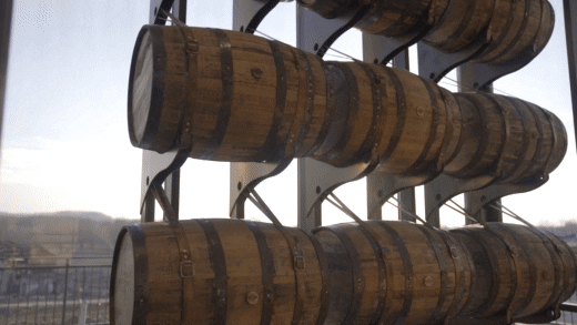 GIF montage of Log Still Distillery with barrels and a shot of the distillery logo.