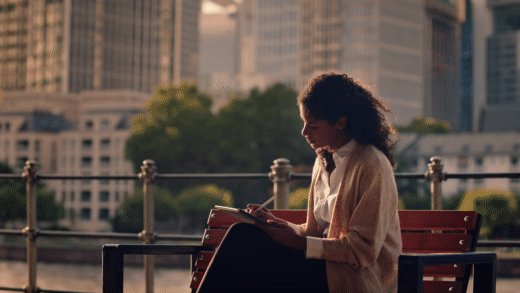 GIF of a woman sitting on a bench outside writing on a tablet with a smart pencil, and a man in an office waiting on a tablet with a smart pencil