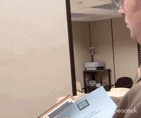 A man posting an open position flyer.