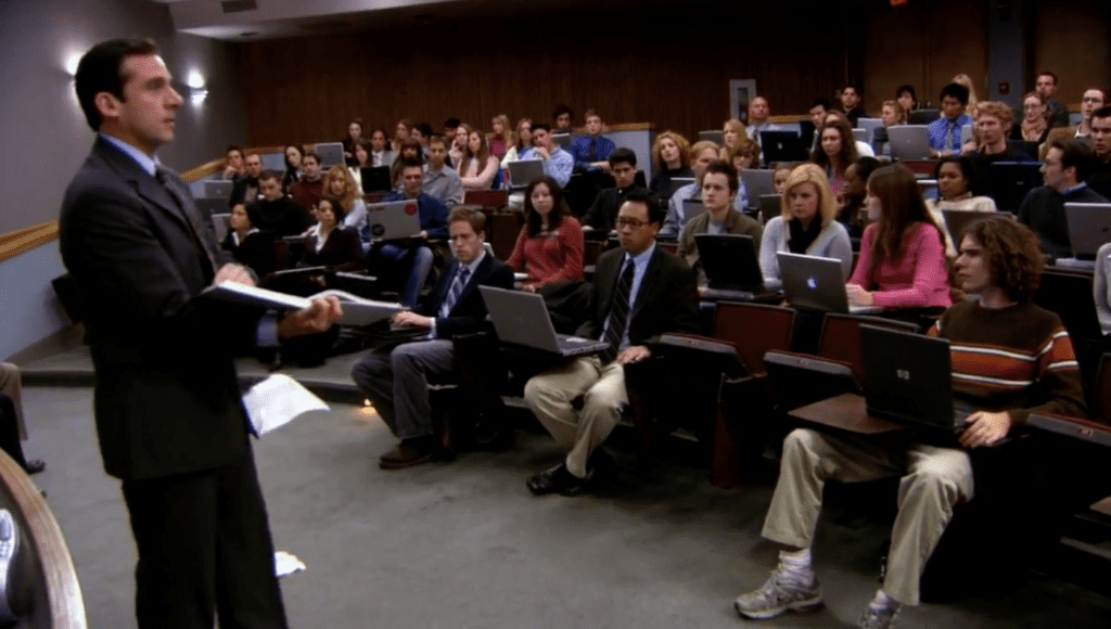 Man speaking to a growing audience.