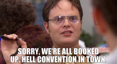 A man saying that an event is overbooked. A real-life event horror situation.